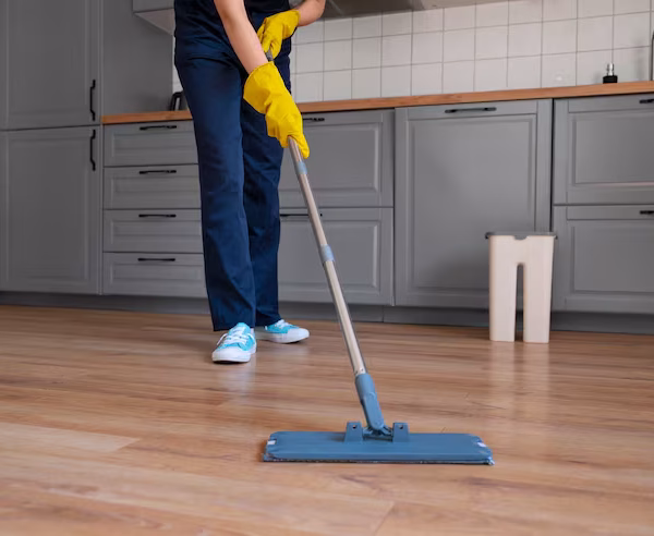 front-view-woman-cleaning-home_23-2150453323