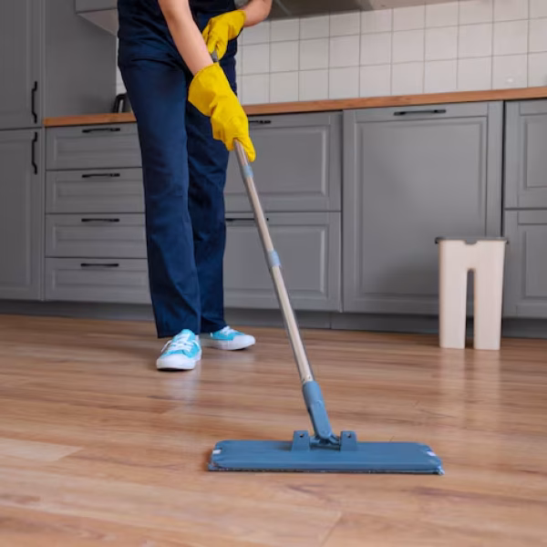 front-view-woman-cleaning-home_23-2150453323