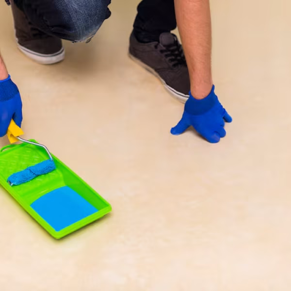 man-using-blue-paint-roller_23-2148384507